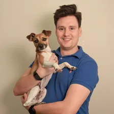 James Follent holding his dog
